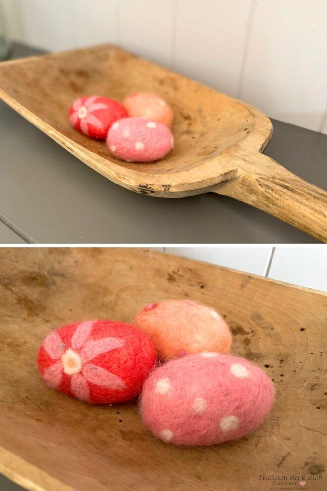drei gefilzte Ostereier in pink und orange in einer Holzschale