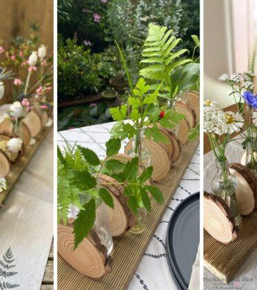 Rustikale Dekoration mit Holzbrett und Baumscheiben und unterschiedlichen Blumen